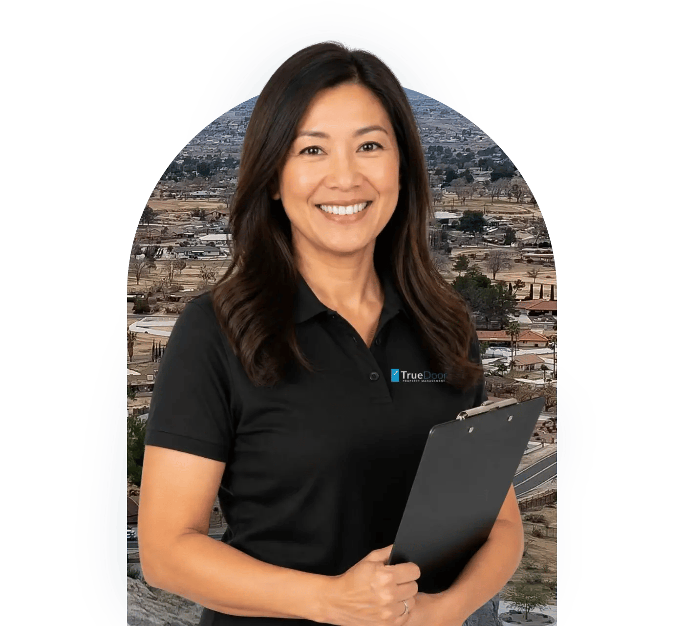 TrueDoor property manager with a clipboard in front of a view over Apple Valley and the High Desert